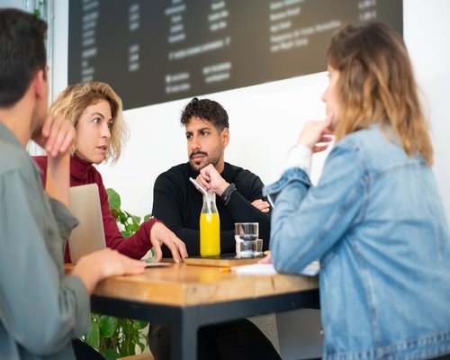 People discussing in a cafe